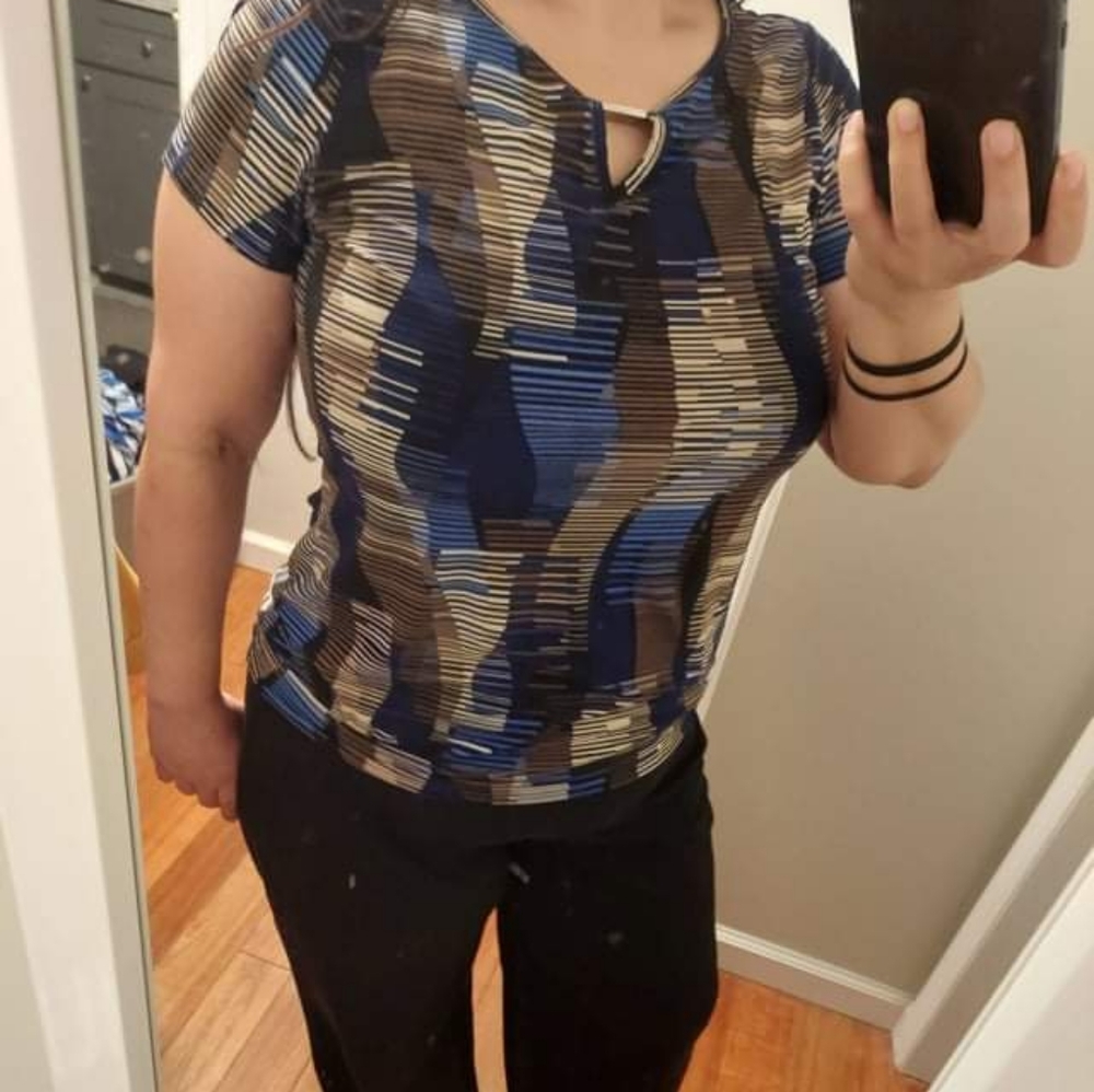 Blue and black patterned top with V shaped cut out